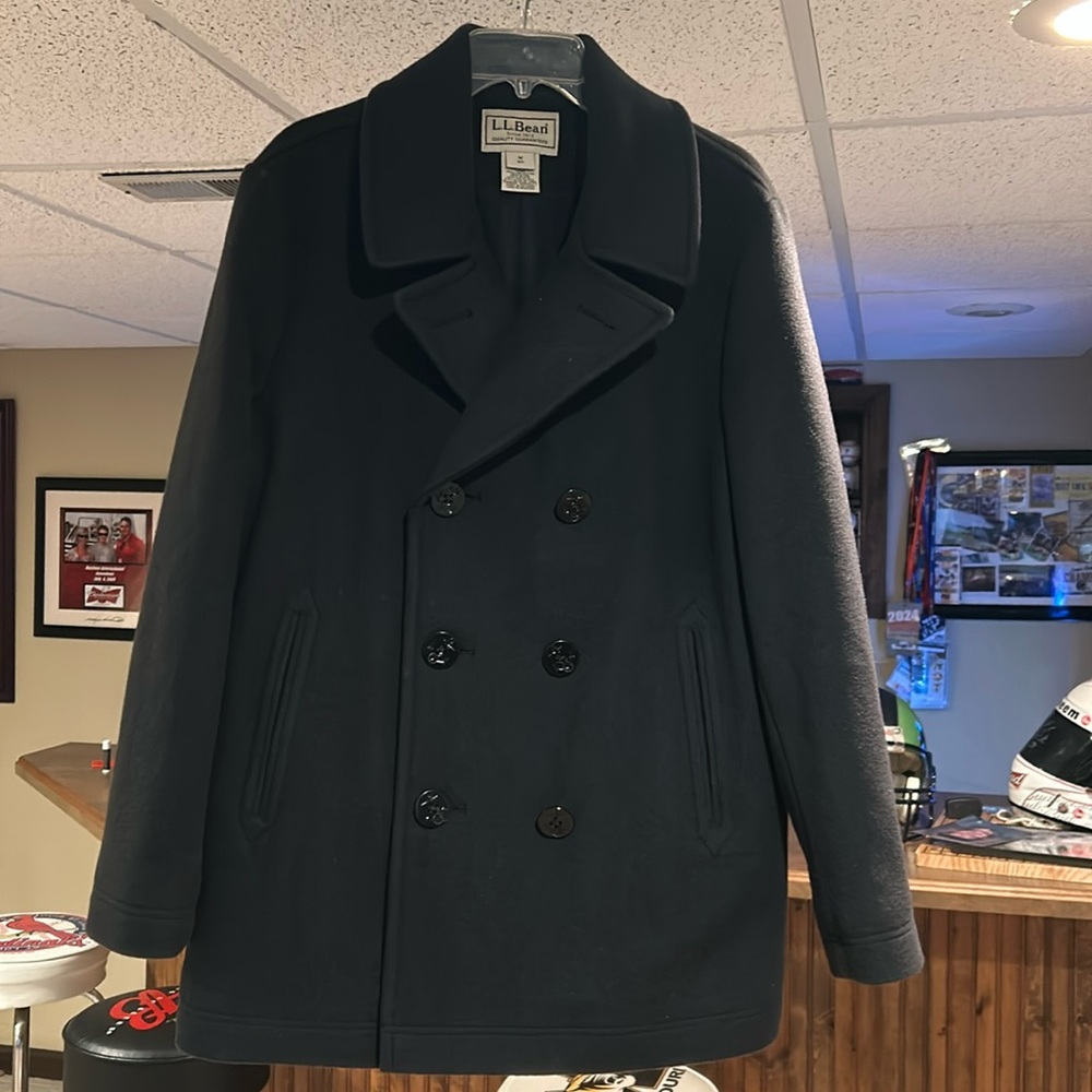 NWOT LL Bean Navy Pea coat.  Worn once.
Excellent condition.